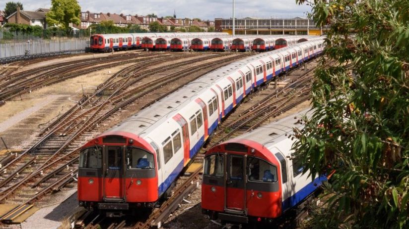 Two Tiube trains travel on above-ground tracks