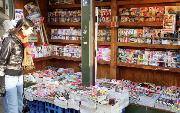 LONDON, United Kingdom: A woman browses a selection of magazines on sale at a news stand in central London, 24 January 2006. Real life stories of tragedy, fortune, love and despair are making tabloid magazines more popular in Britain rather than celebrity gossip in another boon for reality entertainment. AFP PHOTO/ADRIAN DENNIS (Photo credit should read ADRIAN DENNIS/AFP/Getty Images)
