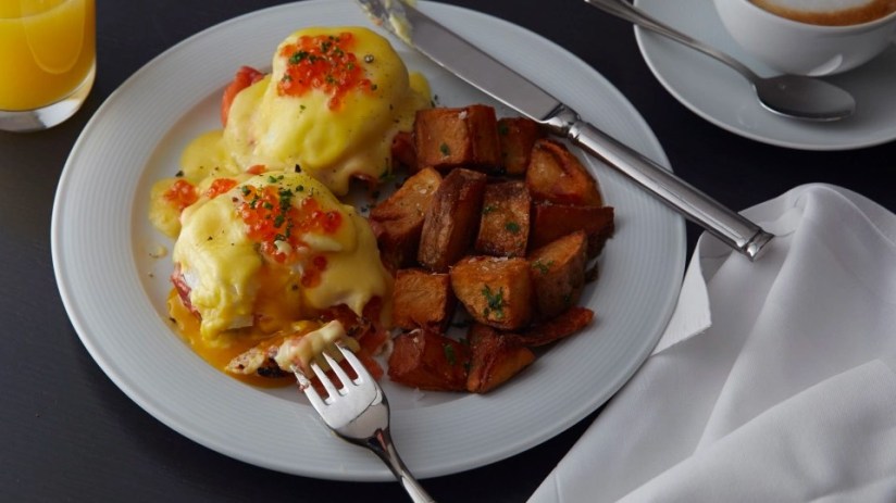 Breakfast: Smoked salmon eggs benedict with herb-roasted potatoes at the Loews Regency Hotel