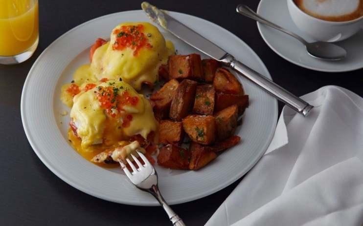 Breakfast: Smoked salmon eggs benedict with herb-roasted potatoes at the Loews Regency Hotel