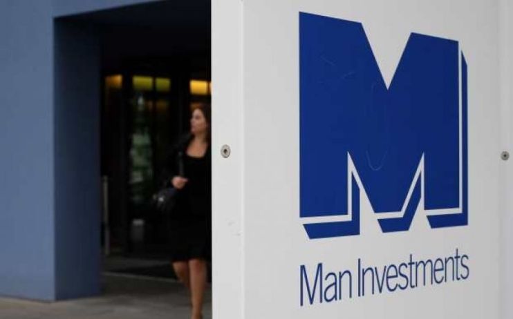 Man Group has been hit by the pound's devaluation against the dollar, reporting a negative forex impact of $4.5bn (&pound;3.9bn).