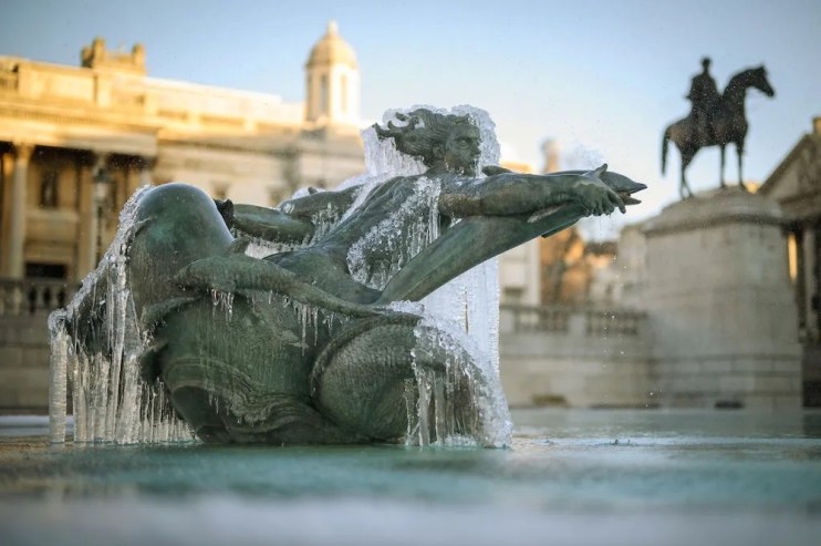 Icicles hang from a statue in the fountains of Trafalgar Square as sub-zero temperatures hit London last year. Frost will hit areas from Tuesday evening, with snow predicted in parts of Scotland, forecasters say.