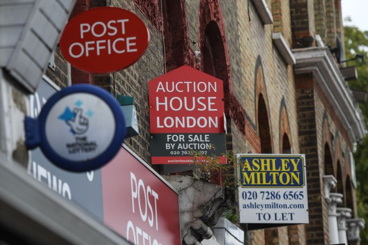 A 'To Let' sign is seen above businesses in Maida Vale (Photo by Peter Summers/Getty Images)