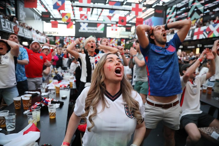 England fans react as they watch England face Spain in the men's UEFA Euro 2024 final.