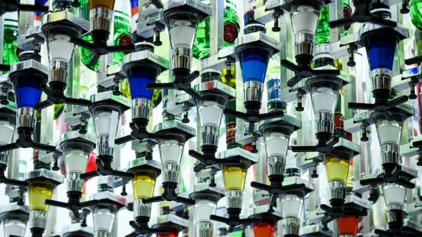 LONDON, ENGLAND - AUGUST 07: Bottles of alcoholic spirits are seen mounted above "Toni", an automated cocktail maker made by "Makr Shakr", during a press event to promote the "AI: More than Human" exhibition at the Barbican Centre on August 07, 2019 in London, England. Six bartenders were asked to mix certain cocktails in a bid to beat the robotic system in a taste-test challenge. The "AI: More than Human" exhibition takes a look at creative and scientific developments in artificial intelligence, and explores the evolution of the relationship between humans and technology. (Photo by Leon Neal/Getty Images)