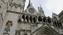 The Royal Courts of Justice building with its gothic architecture and iconic facade in London on a bright day