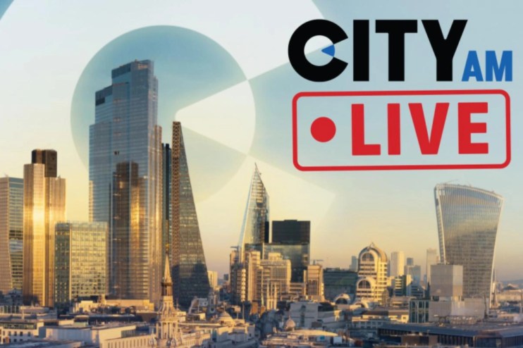 CityAM live blog updates on latest news and business events in an urban setting with bustling streets and skyscrapers