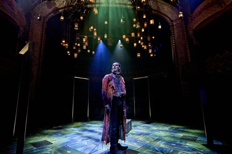 Paul Hilton as Ebenezer Scrooge in A Christmas Carol at The Old Vic, captured during a live performance by Manuel Harlan
