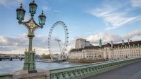 Tourists exploring city streets as new tourism tax policy impacts travel costs and local economies