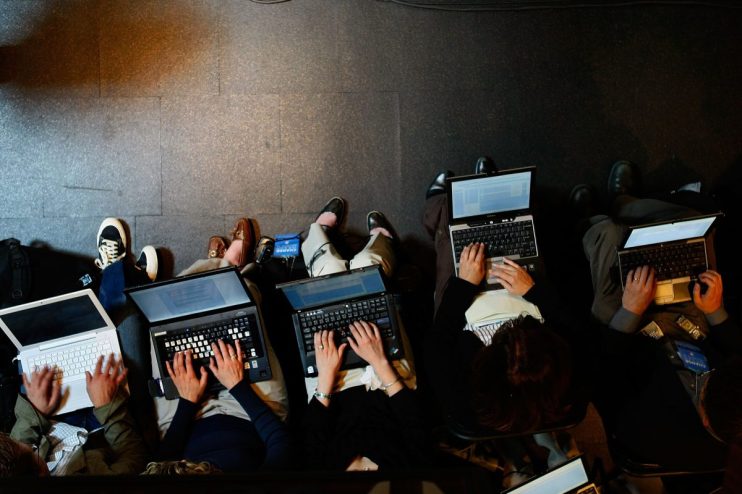 Modern laptops and desktop computers arranged on a sleek workspace, highlighting latest tech trends in digital devices.