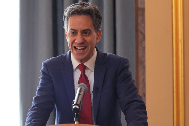 Ed Miliband speaking at clean energy summit, addressing renewable energy strategies and climate action initiatives.