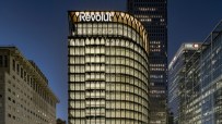 Sleek modern design of Revoluts new office space featuring open workstations and collaborative meeting areas