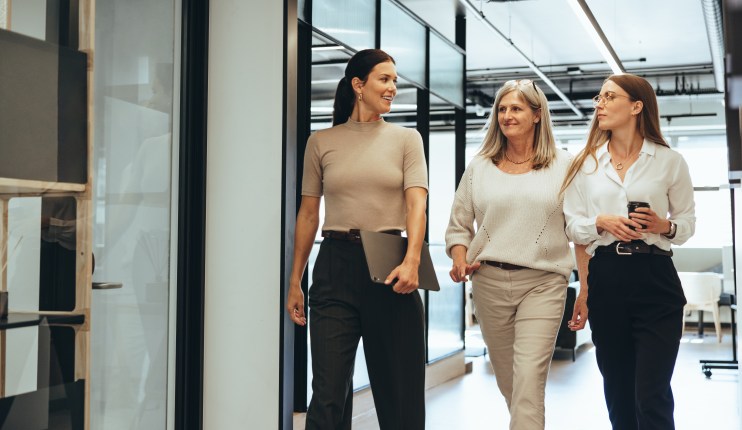 Shutterstock image 2112192284 featuring a general business scene with professionals in a modern office setting.