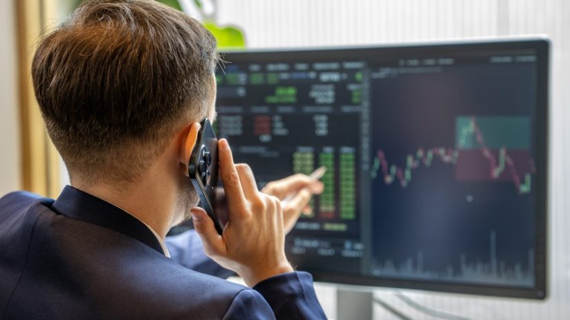 Stock market IPO activity with fluctuating graphs and charts showing financial trends and investor interest