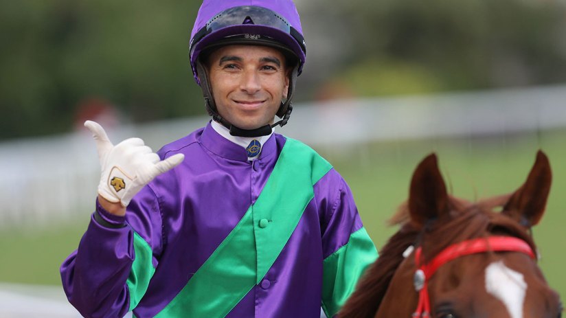 Joao Moreira in action at a prestigious event, showcasing determination and skill in a competitive atmosphere.
