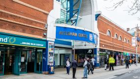Aylesham Centre exterior view showcasing bustling shopping activity in the heart of the local community