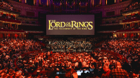 Royal Albert Hall illuminated for Films in Concert series, showcasing iconic movie scenes and live orchestral performances