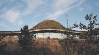Macallan whisky building exterior showcasing modern architecture and scenic landscape, highlighting premier whisky craftsm...