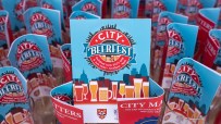 City Beerfest attendees enjoying a sunny day in London with iconic skyline views, organized by Canada Corporation.