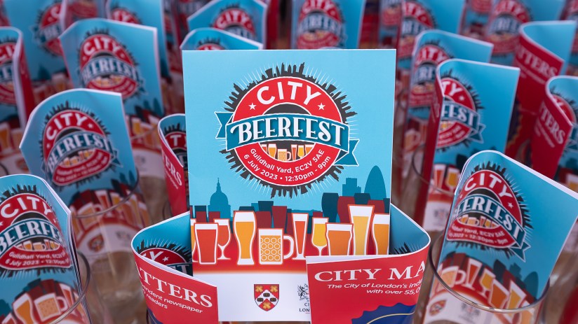 City Beerfest attendees enjoying a sunny day in London with iconic skyline views, organized by Canada Corporation.