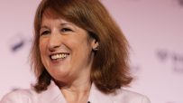 Rachel Reeves speaking at BCC conference, addressing economic policies and business growth strategies, wearing professiona...
