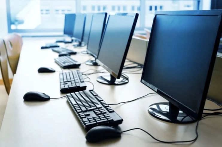 Modern office setup with a sleek computer on a desk, showcasing the latest technology trends in a professional workspace.