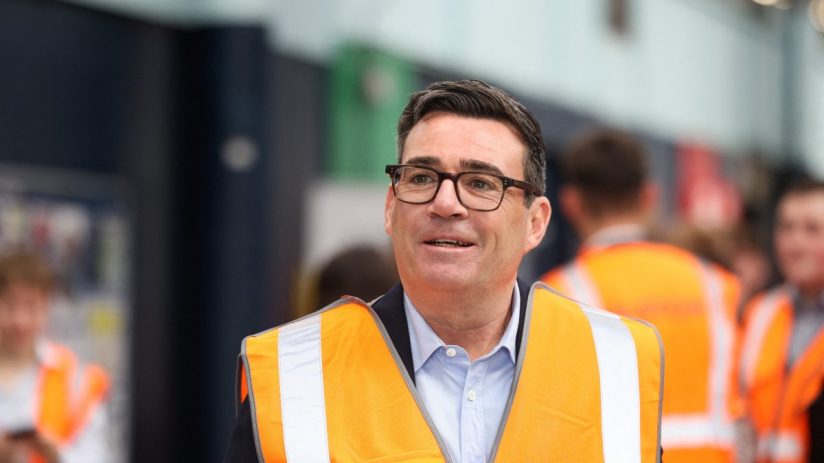 Andy Burnham, Mayor of Greater Manchester, in a high-vis vest at a technical education event.
