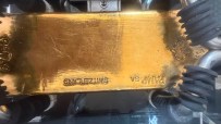 Gold bar stamped PAMP SA SWITZERLAND on display at the Bank of England Museum, showcasing financial assets.