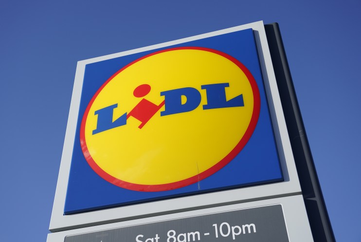 Lidl supermarket sign with blue, yellow, and red logo against a clear blue sky
