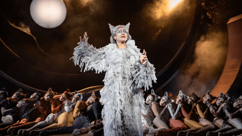 Grizabella in a shaggy white costume with cat ears, performing Memory from Cats musical at Regents Park Open Air Theatre